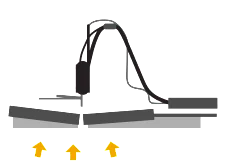 3D printer printing arrows on build plate.