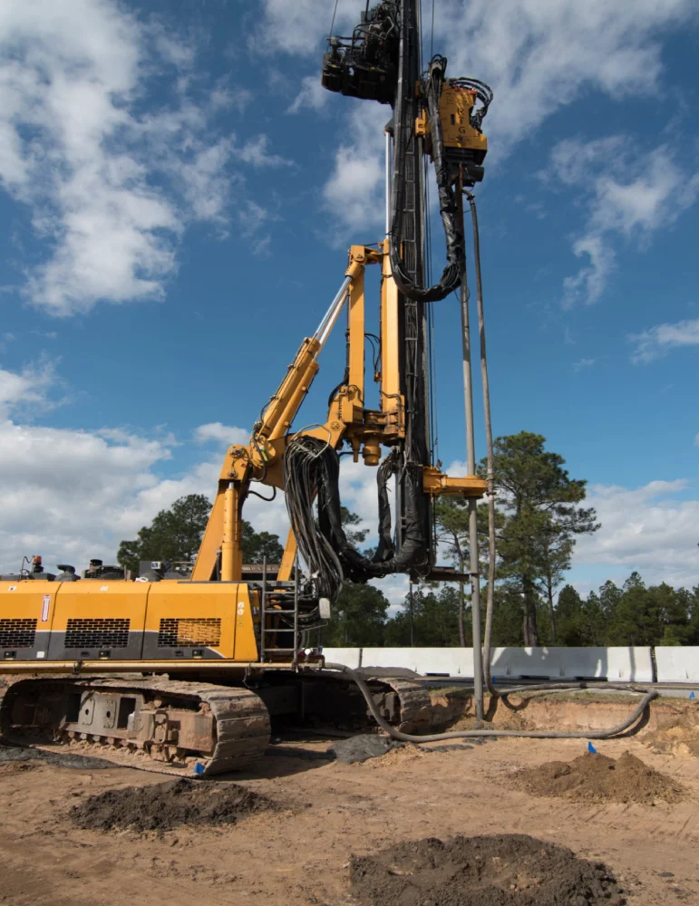 Industrial drilling rig at construction site.