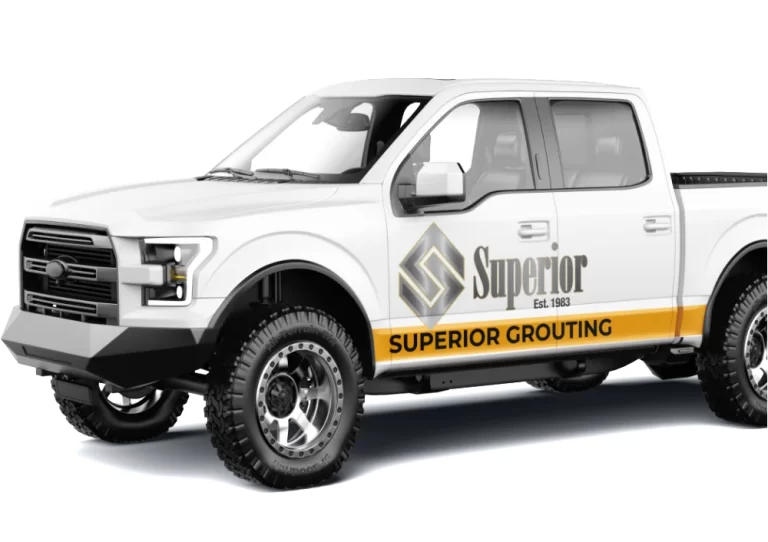 White pickup truck with Superior Grouting branding.