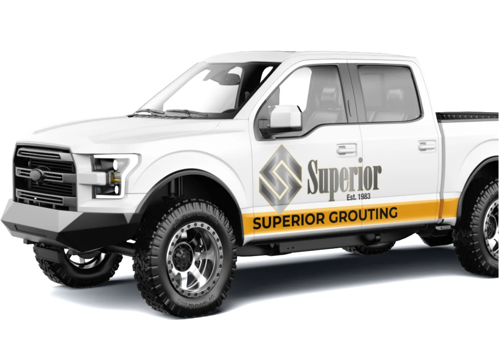 White pickup truck with Superior Grouting branding.