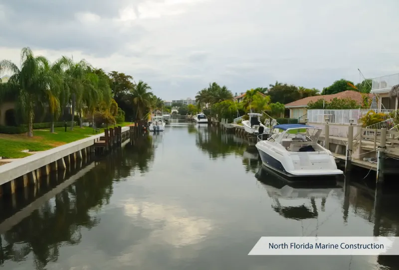 Canal with boats near residential area in North Florida.