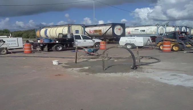 Industrial site with tanker trucks and equipment