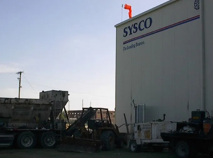 Sysco building exterior with industrial equipment.