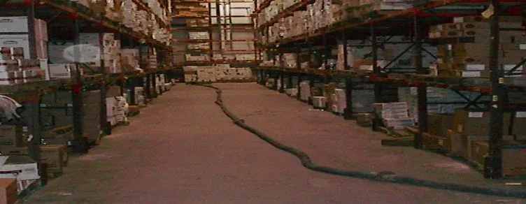 Warehouse interior with shelves and boxes.