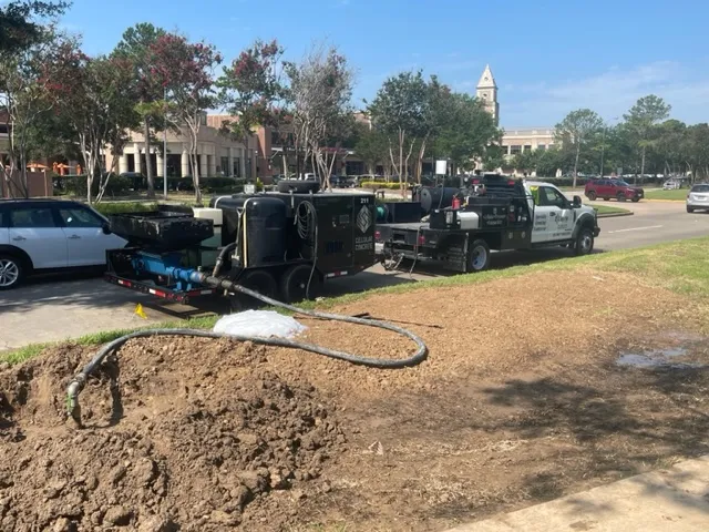 Utility truck and equipment at excavation site.