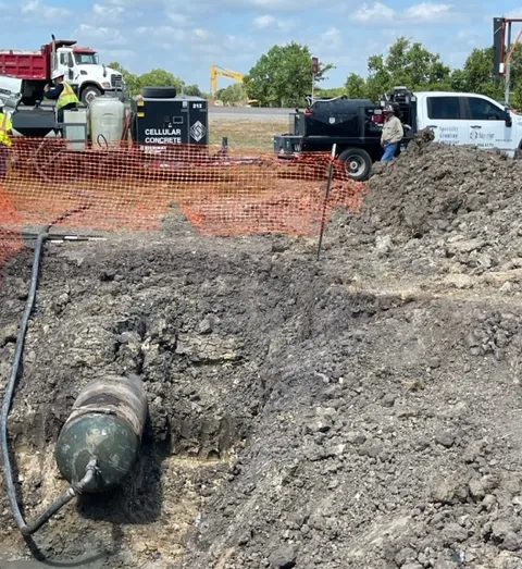 Construction site with excavation and equipment.